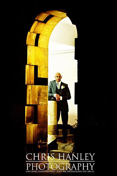 Trinity College Cambridge wedding by Chris Hanley Photography 02 Geoff framed by an archway at Trinity College - love this.
