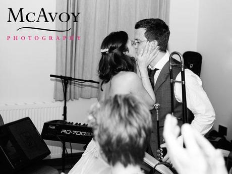 Beeston Manor wedding by McAvoy Photography 426 Jane kisses Chris after he plays with the band