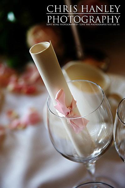 Lovely little rolled scroll wedding favours with pink ribbon Lovely little rolled scroll wedding favours with pink ribbon