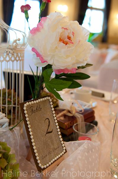 Vintage London wedding tables Table numbers on soft brown shades and 