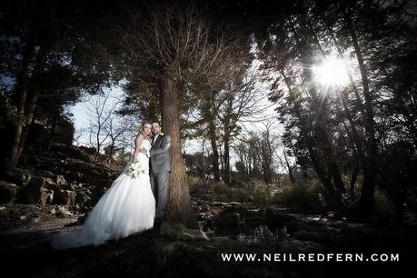 Bride and groom portrait in woodland by Neil Redfern