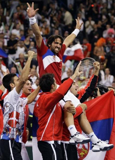 Janko Tipsarevic (C) of Serbia celebrates with his teammates after beating Czech Republic in their Davis Cup world group semi-final tennis match in Belgrade September 19, 2010. REUTERS/Marko Djurica (SERBIA - Tags: SPORT TENNIS)