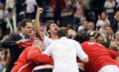 Novak Djokovic (C) of Serbia celebrates with his teammates after they beat Czech Republic in their Davis Cup world group semi-final tennis match in Belgrade September 19, 2010. REUTERS/Marko Djurica (SERBIA - Tags: SPORT TENNIS)