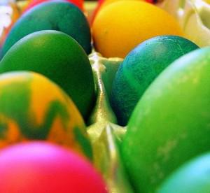 colored Easter eggs in a egg carton