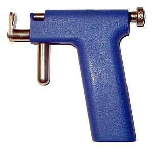 Piercing guns, like this one with its plastic,...