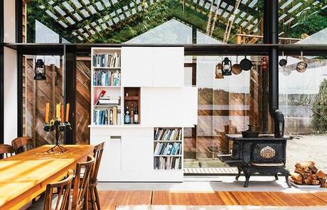 Glass-walled garage for entertaining with Corian bookshelf