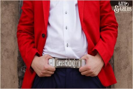 Groom preparation photography RSC Swan Theatre Wedding Photographer  belt red jacket