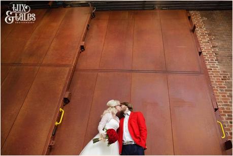 RSC Swan Theatre Wedding Photographer Royal Shakespeare Company bride & groom kiss outside the stage door