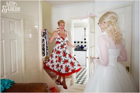 Bride preparation photography RSC Swan Theatre Wedding Photographer bridesmaid in red rose dress
