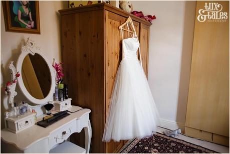 Bride preparation photography RSC Swan Theatre Wedding Photographer Dress hanging on wardrobe