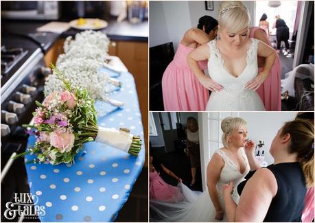 Bride Preparation photography East Riddlesden Hall wedding photographer flowers on ironing board and bride getting into dress