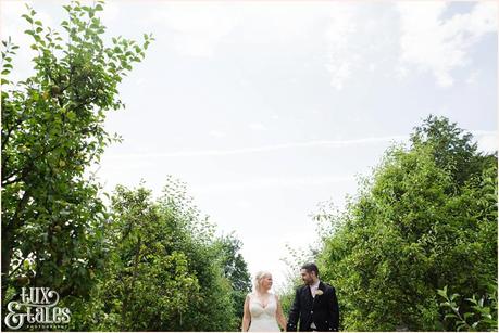 East Riddlesden Hall Wedding Photography pink English garden theme | walking through gardens