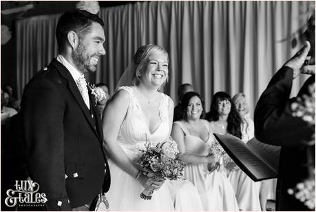 East Riddlesden Hall Wedding Photography pink English garden theme laughing during ceremony
