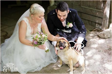 East Riddlesden Hall Wedding Photography pink English garden theme | Bride & Groom with dog