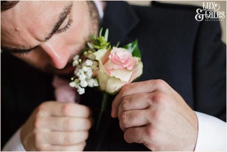 Groom preparation photography East Riddlesden Hall Wedding Photographer pink rose buttonhole