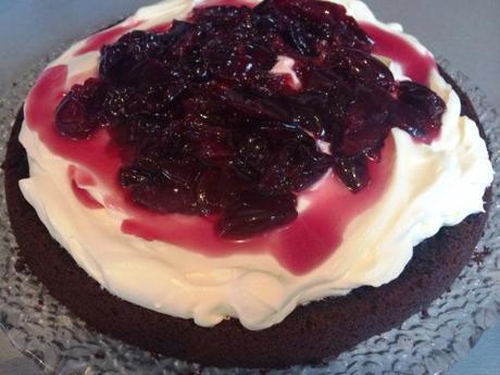 Traditional Black Forest Cake oozing cherries and cream on black forest rich chocolate cake