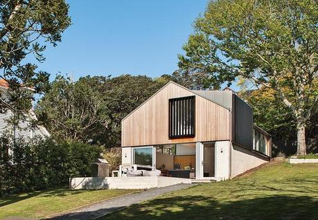Brick Garage Transformed Into Family Home Modern home with brick base and cedar rain screen on top level