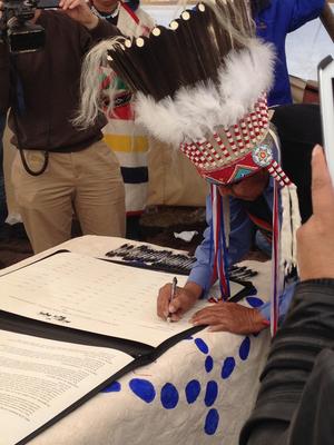 Historic Treaty: Bring Buffalo Home, Heal the Prairie Chief Earl Old Person signs buffalo treaty