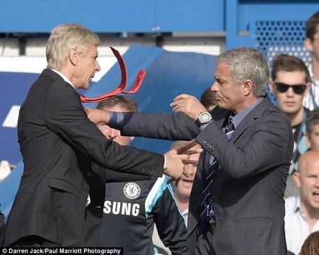 Arsene Wenger shoves Jose Mourinho in the chest with 20 minutes gone at Stamford Bridge on Sunday 