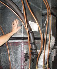 Hand on furnace plenum Hand on furnace plenum