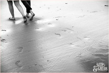 Whitby Love Shoot | Cass & Josh Photography Engagement Shoot in Whitby | Girl wearing Red Flower crown | Alterntive Couple whereing Vintage clothing | footprints int he sand