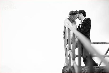 Whitby Love Shoot | Cass & Josh Photography Engagement Shoot in Whitby | Girl wearing Red Flower crown | Alterntive Couple whereing Vintage clothing | Couple on the steps hugging and kissing