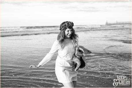 Whitby Love Shoot | Cass & Josh Photography Engagement Shoot in Whitby | Girl wearing Red Flower crown | Alterntive Couple whereing Vintage clothing | Running through the ocean water holding shoes