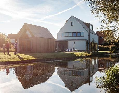 Amsterdam canal house facade with pitched roof Amsterdam canal house facade with pitched roof