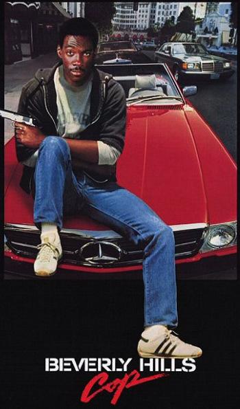 Axel Foley Eddie Murphy posing as Axel Foley for the Beverly Hills Cop (1984) poster. Like most movie posters, it replaces the gun he actually used in the film (Browning Hi-Power) with an incorrect airbrushed replacement (M1911A1).