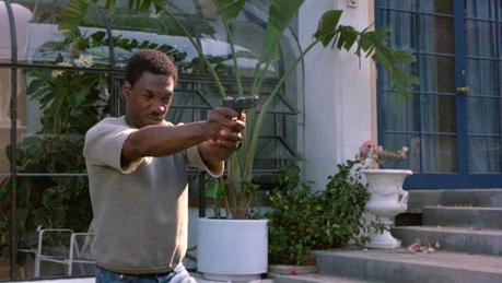 Axel Foley Eddie Murphy displays an impressive grip and handling techniques when firing his Hi-Power in the film.