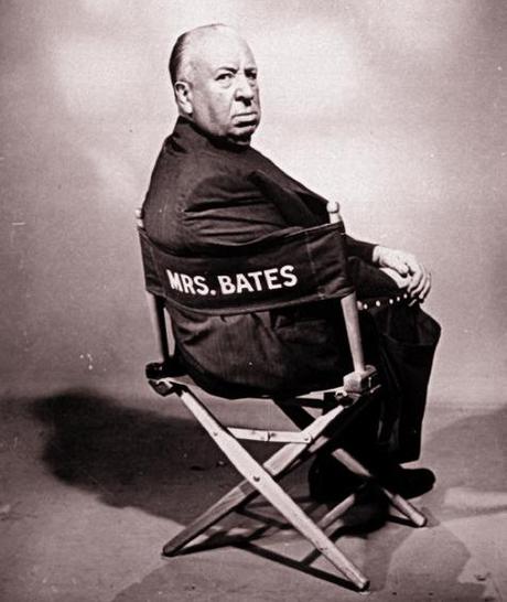 Alfred Hitchcock who directed horror movie thriller Psycho sitting in director's chair reserved for Norman's mother Mrs. Bates