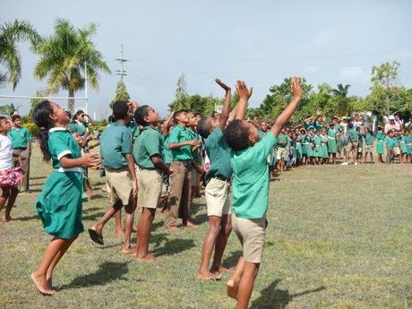 Children watch a drone at RMKS Primary School in Fiji