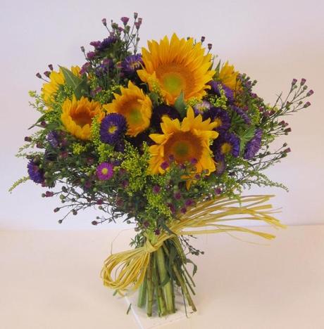 Small bridal bouquet with purple flowers and sunflowers