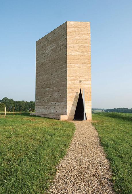 Modern religious architecture like Bruder Klaus Chapel by Peter Zumthor that is made of concrete and charred wood interior