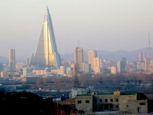 Again: “Confess your crimes against the people of North Korea or you will not be allowed to leave the country tomorrow” Pyongyang skyline dwarfed by unfinished hotel (not the Yanggakdo)