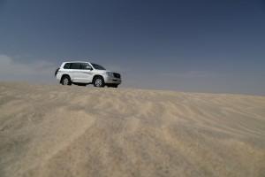 Our 4wd vehicle parked on top of a sand dune