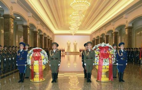 A KPA Honor Guard stands alongside floral baskets from Kim Jong Un (L) and the KPA ( R)  (Photo: Rodong Sinmun).