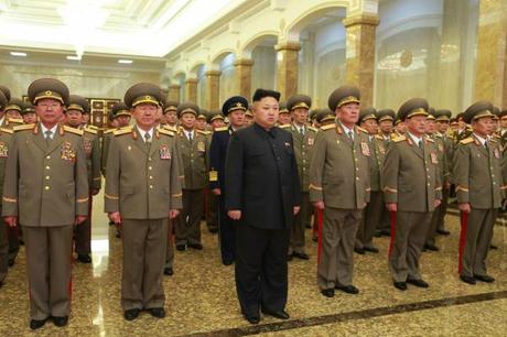 Kim Jong Un stands in the statue hall at Ku'msusan Memorial Palace of the Sun in Pyongyang around midnight on January 1, 2015 (Photo: Rodong Sinmun).
