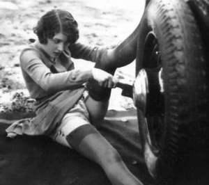 woman changing a tire