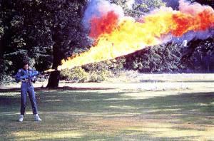 Sigourney-Weaver-testing-the-flamethrower-for-Alien-on-the-lawn-at-Shepperton-Studios