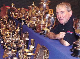 Visiting the Joey Dunlop Memorial in Tallinn, Estonia Northern Irish motorcycle legend Joey Dunlop with some of his trophies.
