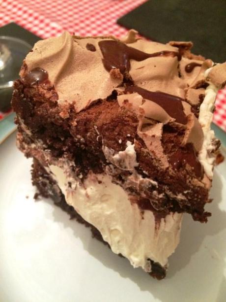 slice of mocha meringue cake chocolate and coffee with cream filling and brownies