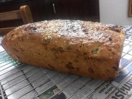 Baking --Whole Wheat ,Oats  and Pistachio  Bread  with a sprinkle of garlic scapes