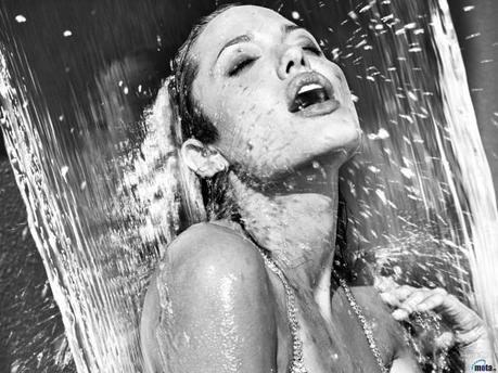 Yes, that is Angelina Jolie looking smoking hot under a waterfall. 