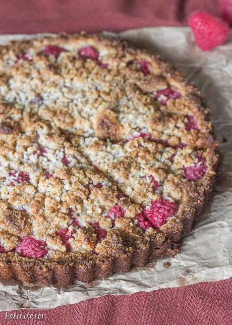 Raspberry Coconut Crumble Tart (Paleo, GF + Vegan) This Raspberry Coconut Crumble Tart has an almond coconut crust that doubles as a crumble topping, filled with fresh raspberries! This easy recipe is Paleo-friendly, gluten free, refined sugar free, and vegan.