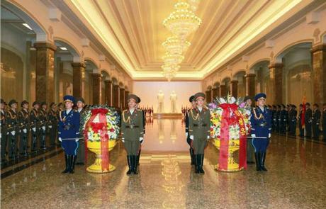 A KPA honor guard with floral baskets from Kim Jong Un (right) and the KPA (left) (Photo: Rodong Sinmun).