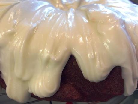 cream cheese frosting oozing on red velvet valentines cake