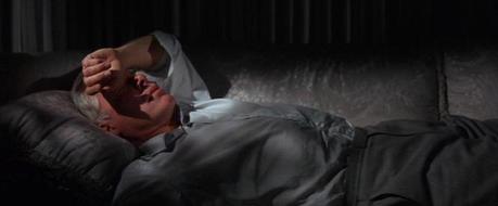Lee Marvin’s Gray Flannel Suit in Point Blank This may not be the most comfortable resting position, but it sure as hell beats the floor of a cell at Alcatraz.