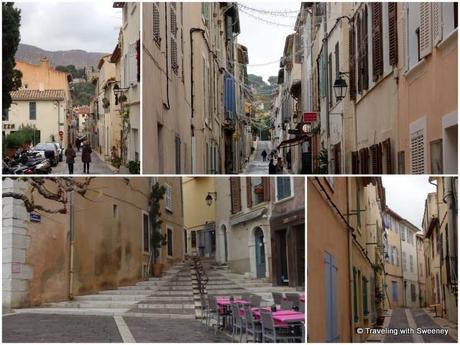 Narrow streets of Cassis lined with colorful houses, shops, and restaurants