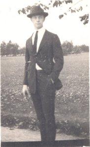 Becoming Dr. Pauling Pauling posing at lower campus, Oregon Agricultural College, ca. 1917.